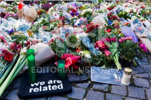 stock-photo-78886685-flowers-candels-and-notes-outside-french-embassy-after-terror-attack-