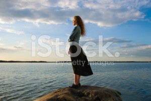 stock-photo-39608918-woman-looks-at-the-horizon