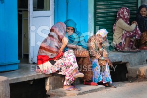 stock-photo-60416580-indian-women-sit-and-chat-on-a-house-porch