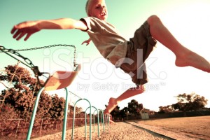 stock-photo-45523272-boy-jumping-off-a-swing