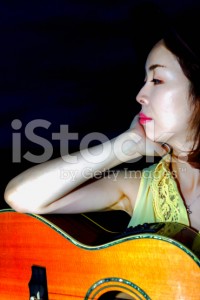 stock-photo-80241789-woman-playing-guitar