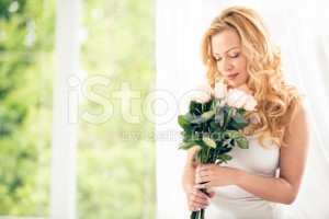 stock-photo-83708763-woman-holding-bunch-of-roses