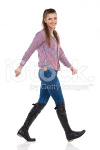 stock-photo-84244725-smiling-young-woman-walking