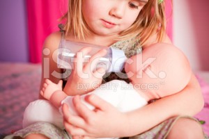 stock-photo-15236454-little-girl-and-her-doll