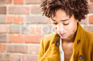 stock-photo-29961348-afro-american-woman-pensive-looking-down