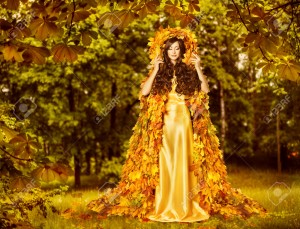 Autumn Fairy Woman in Forest, Nymph in Yellow Leaves Dress, Fantasy Goddess of Earth