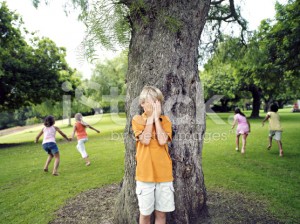 stock-photo-49134342-boy-with-hands-covering-eyes-playing-hide-and-seek