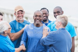 stock-photo-55768606-african-american-man-being-congratulated-by-friends