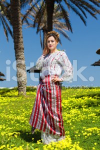 stock-photo-21672418-muslim-girl-standing-in-a-beautiful-garden