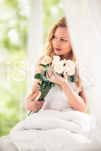 stock-photo-83740129-woman-holding-bunch-of-roses