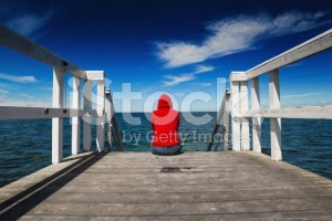 stock-photo-72902315-alone-woman-in-red-shirt-at-the-edge-of-jetty